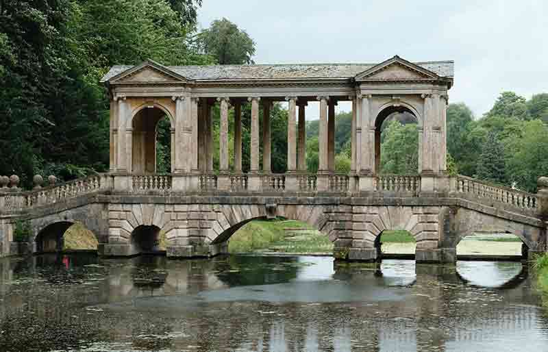 Prior Park Landscape Garden Palladian Bridge reflected in the water.